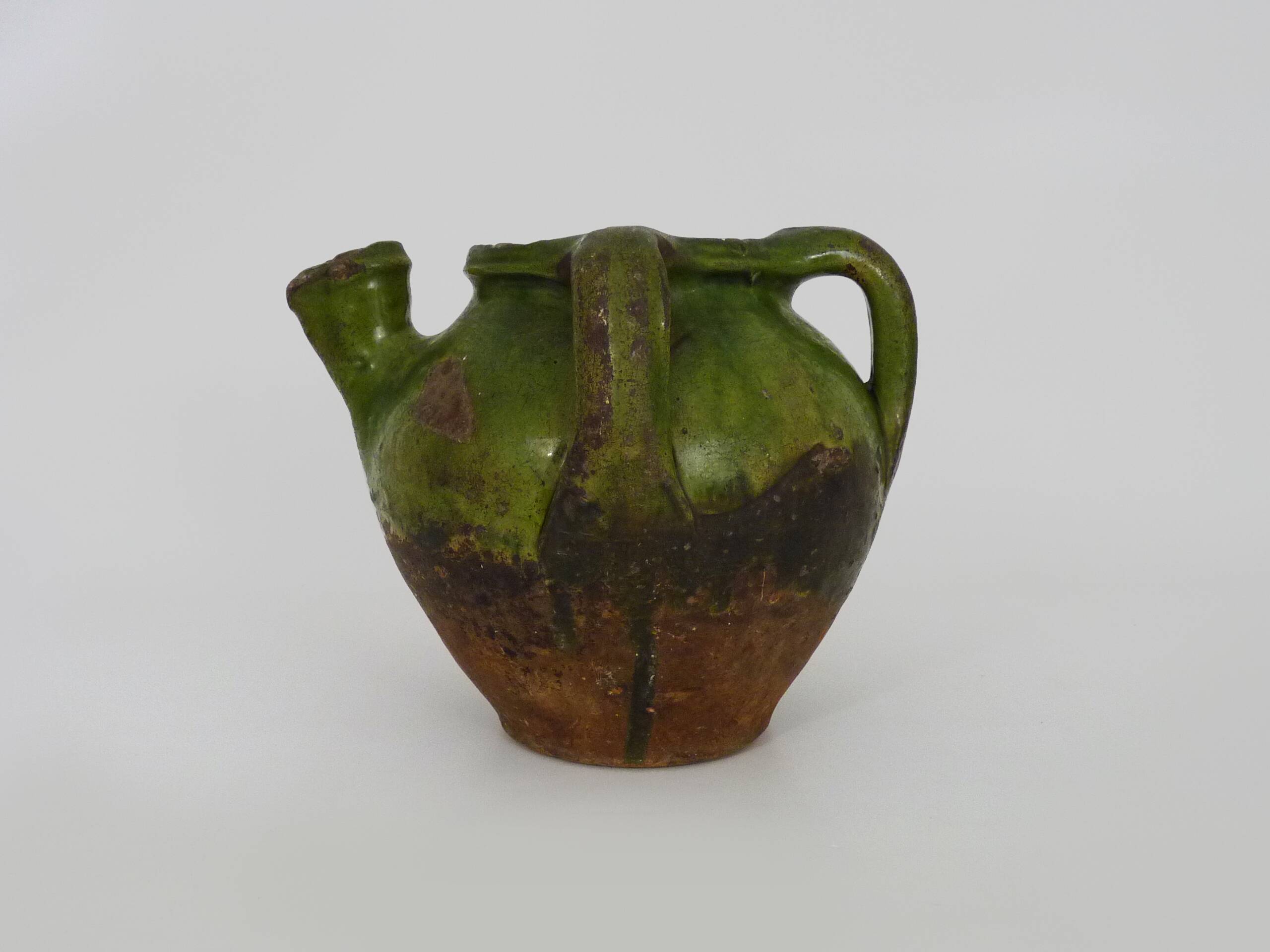 Gargoulette, pottery water pitcher in glazed green terracotta, Haute Pyrénées. 18th century