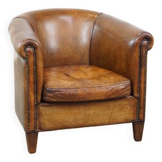 Club chair made of sheepskin leather with the most beautiful colors and a stunning patina