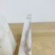 Pair of book greenhouses in alabaster white marble
