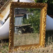 Wooden mirror decorated with gold from the 1920s