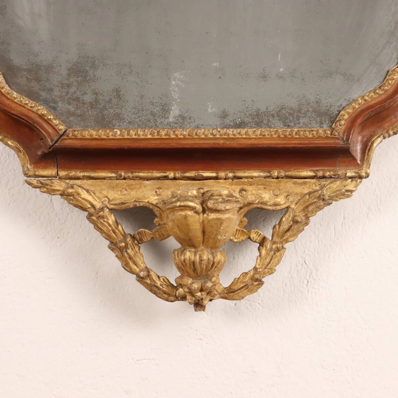 Neoclassical antique mirror in walnut, Italy, 18th century.