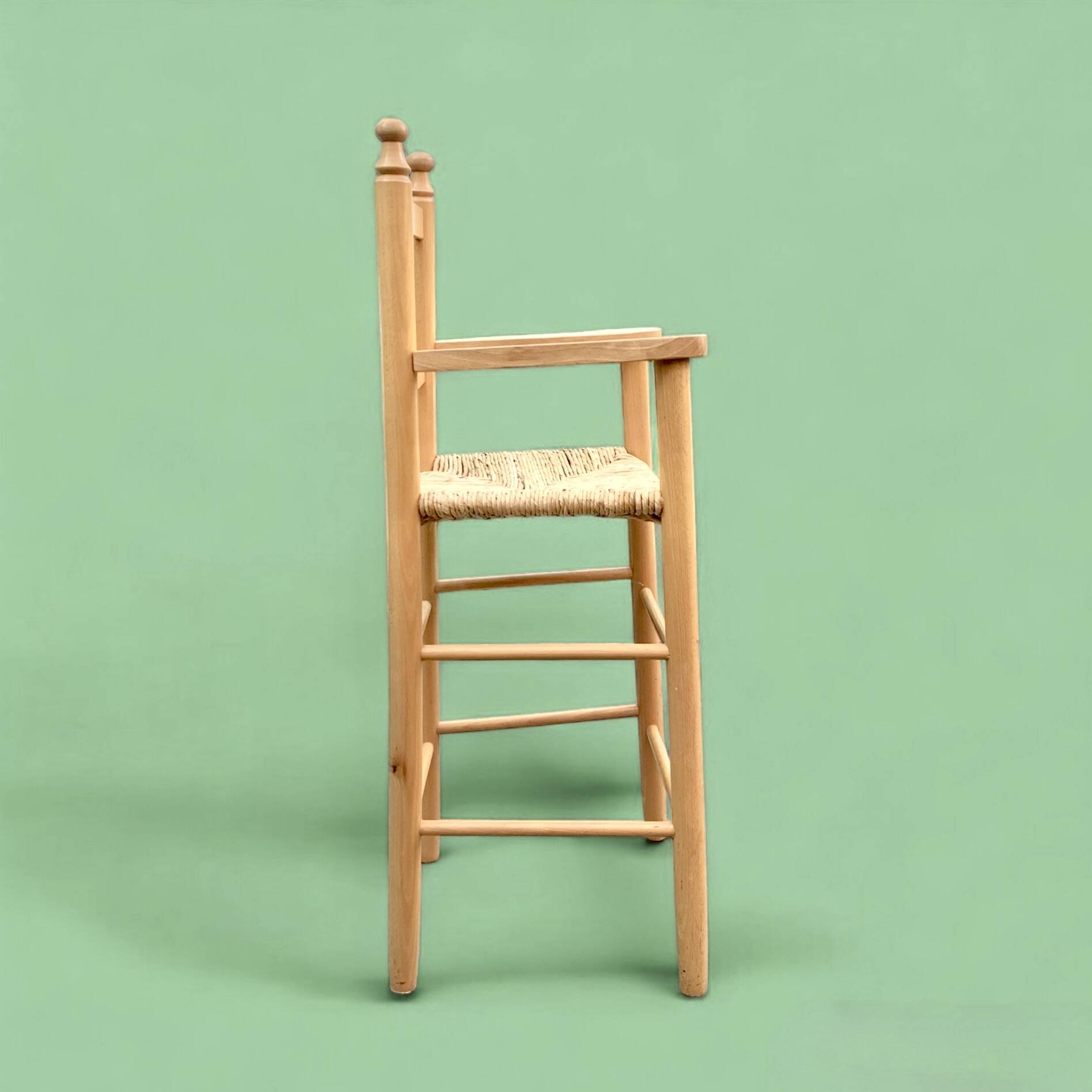 Old wooden and straw high chair for children