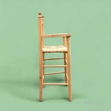 Old wooden and straw high chair for children