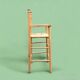 Old wooden and straw high chair for children