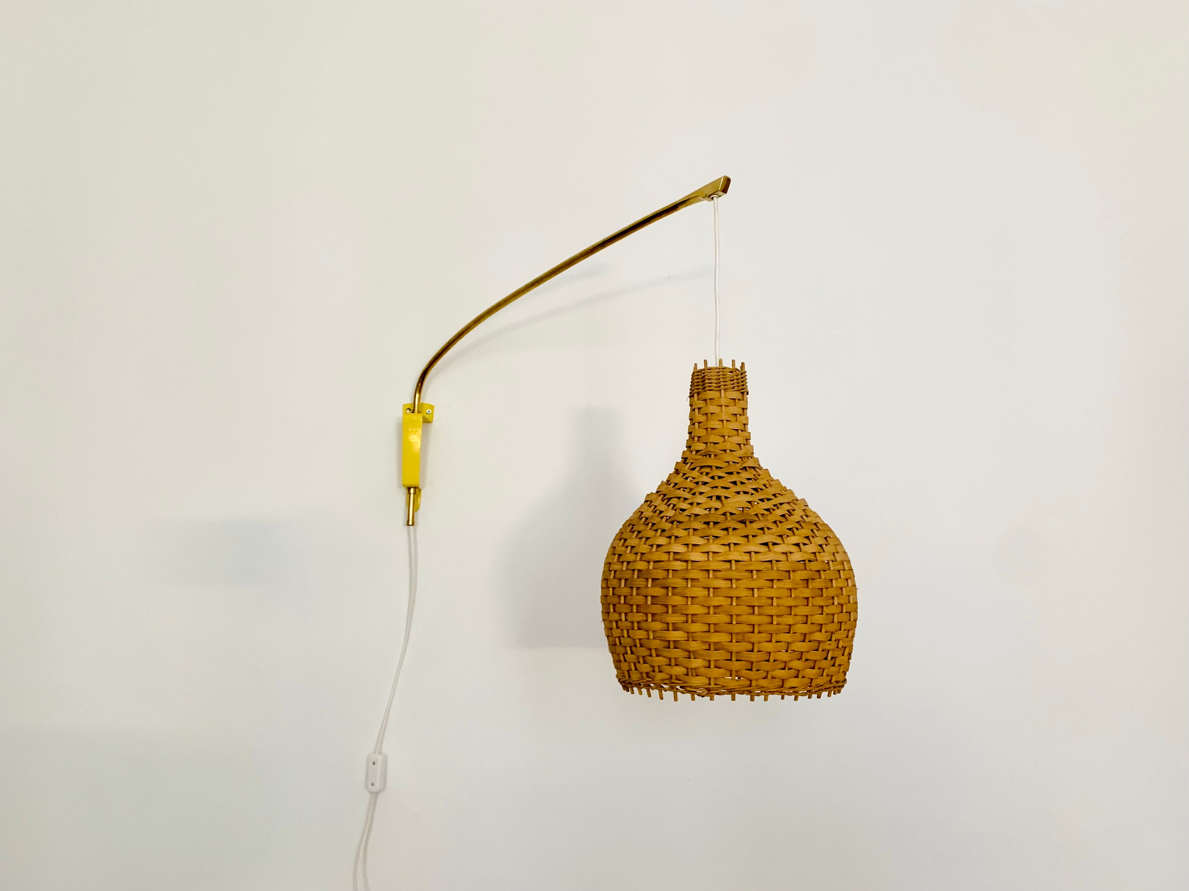 Adjustable Brass and Wicker Arc Sconce