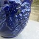 Wall pot in glazed blue terracotta with a grape motif, 1970s.