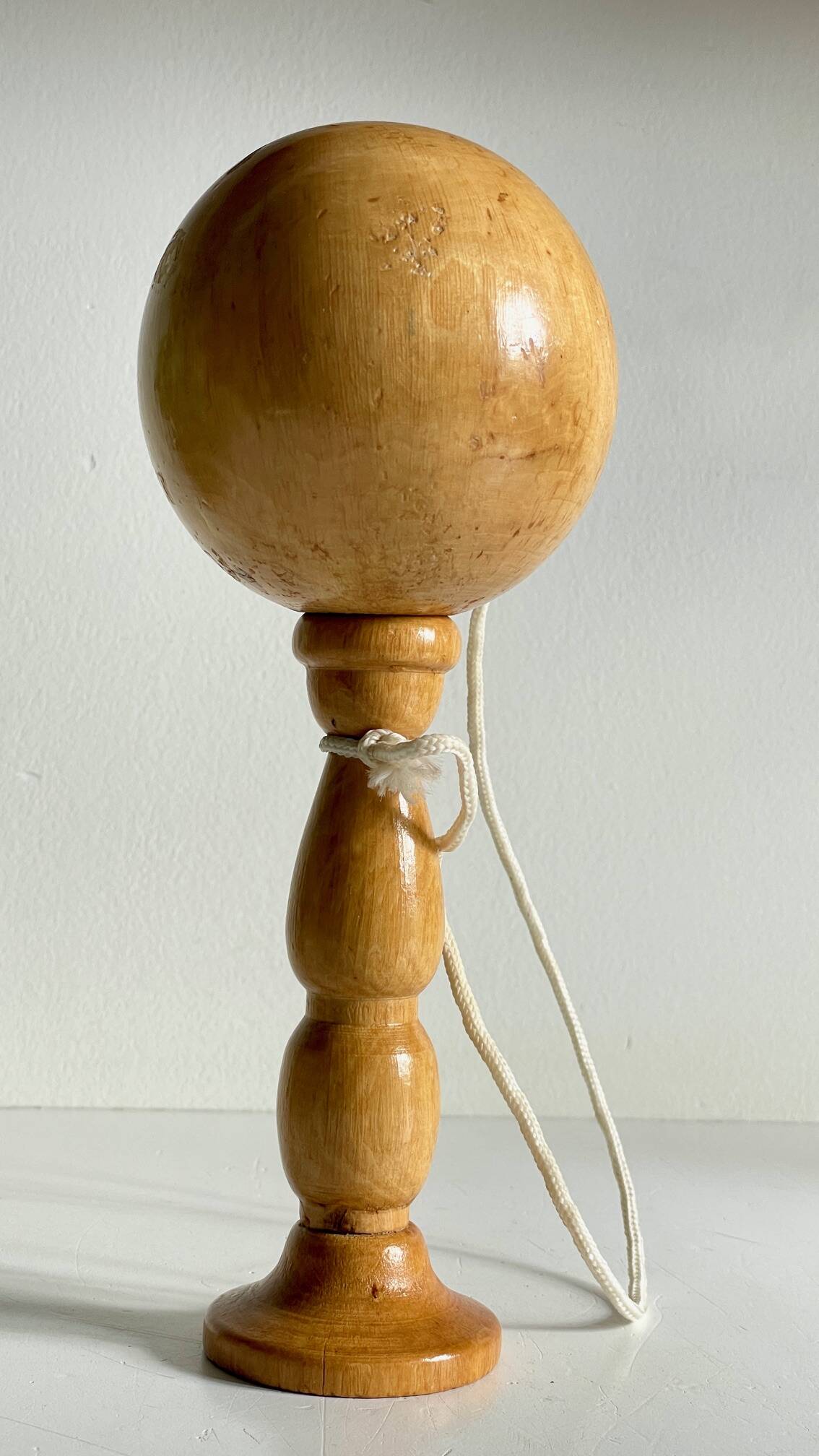 Vintage wooden cup-and-ball toy