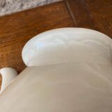 Small light beige earthenware teapot