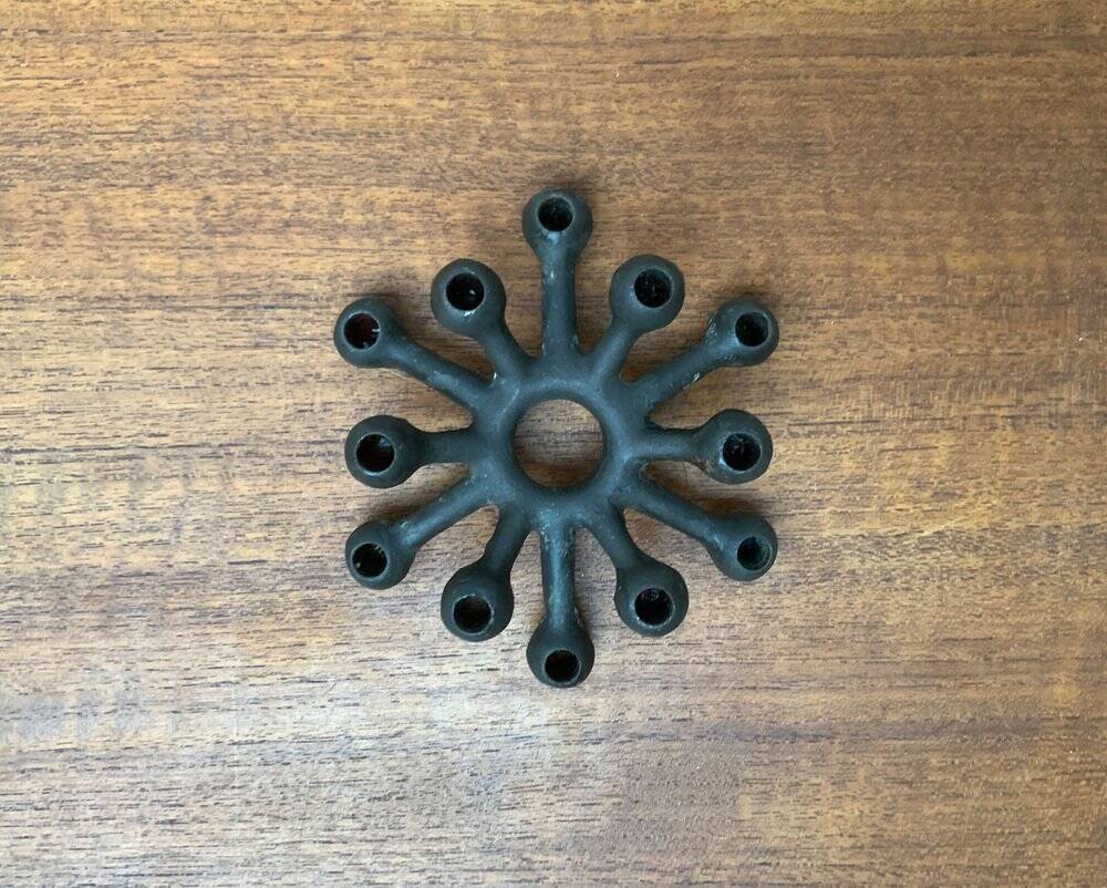 Brutalist Danish candle holder from the mid-century in cast iron by Jens H. Quistgaard.