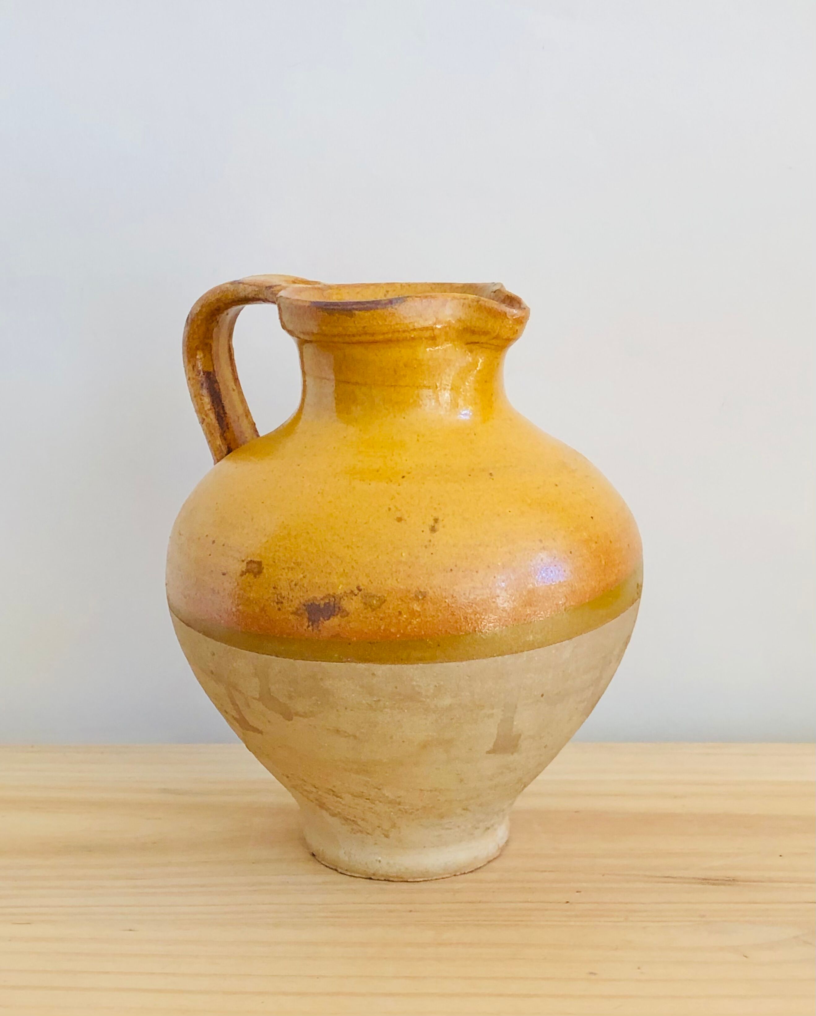 Vintage jug in glazed earth