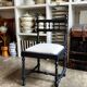 Black turned wooden chair and ivory cotton.
