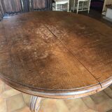 Old oak table with extendable oval central foot