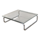 Coffee table in chrome with a glass top.