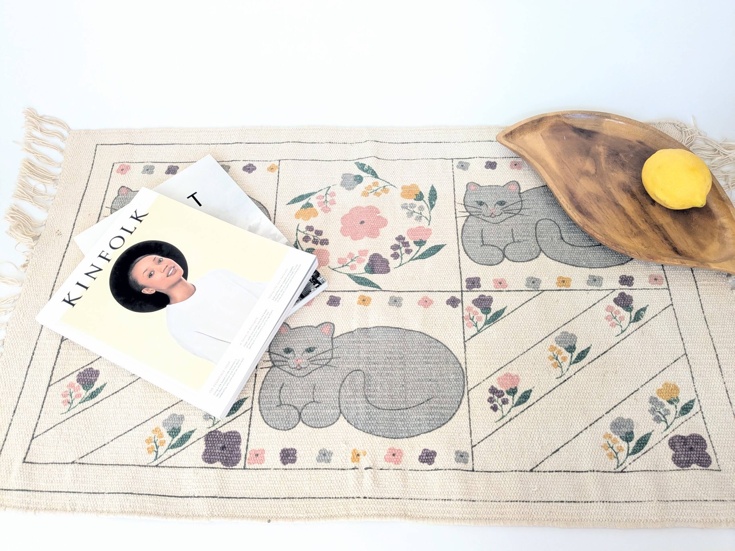 1980s handwoven cotton rug with a cat and flower pattern