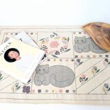 1980s handwoven cotton rug with a cat and flower pattern