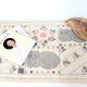 1980s handwoven cotton rug with a cat and flower pattern