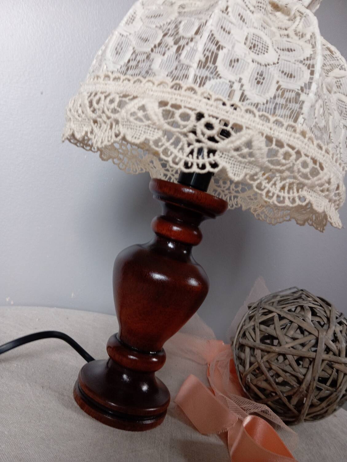 Table lamp with romantic wood and lace ambiance, retro chic