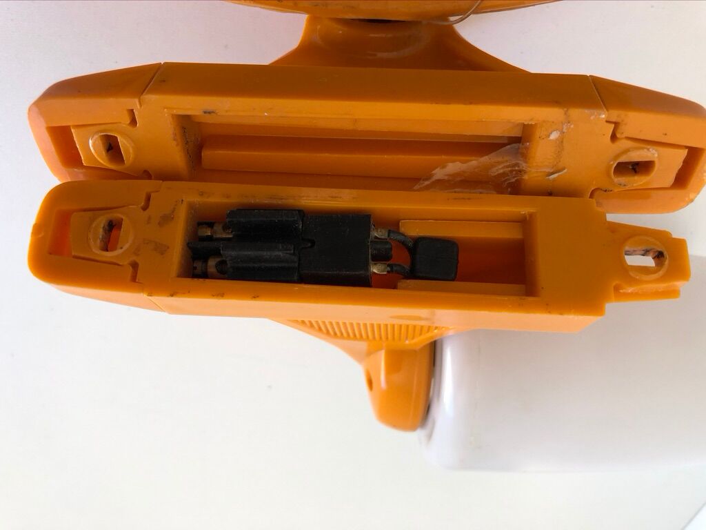 Tiltable orange plastic mirror with matching wall light