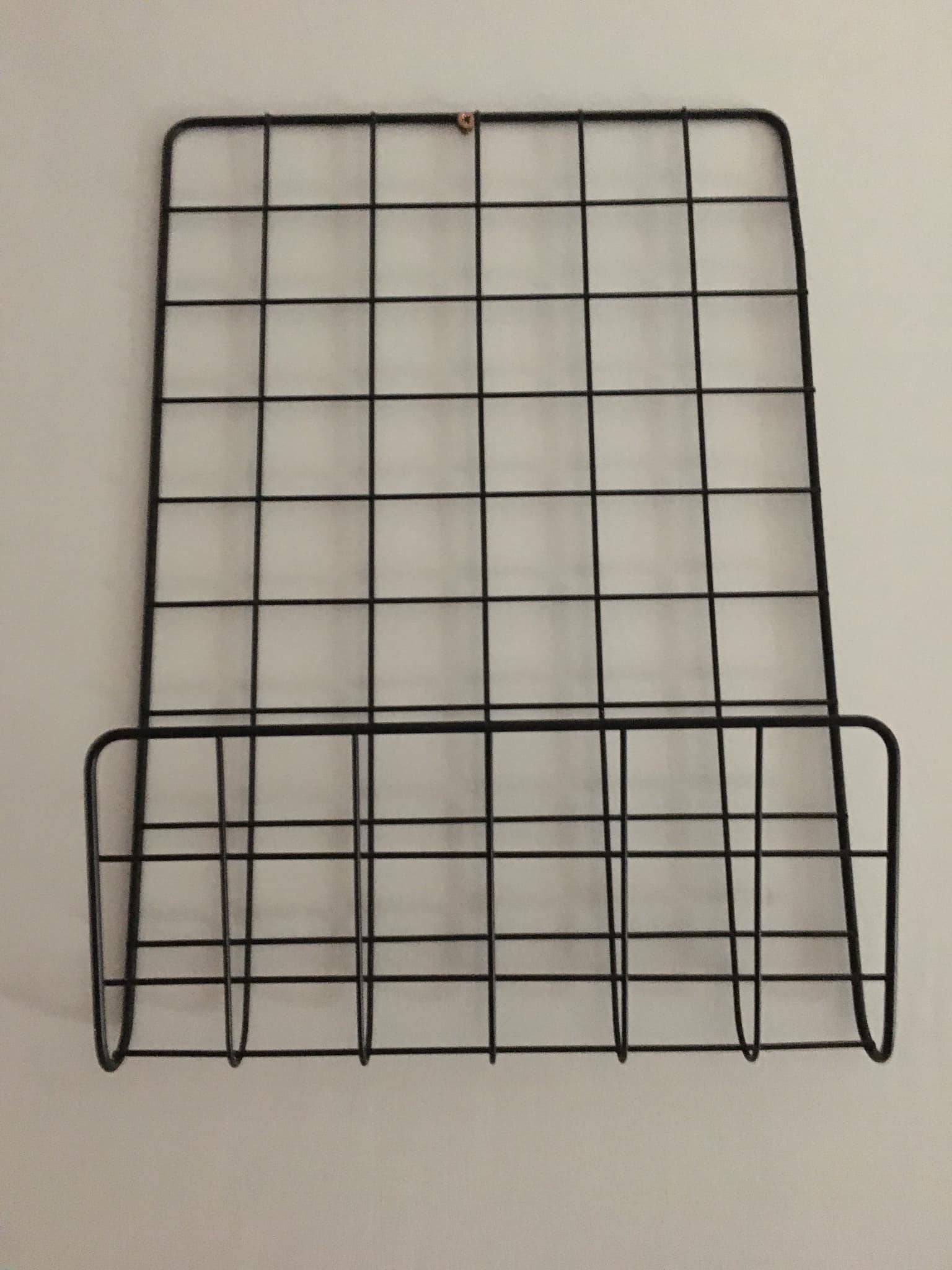 Black metal wall magazine racks to hang