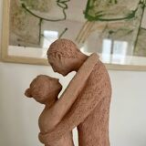 Terracotta sculpture of an entwined couple.