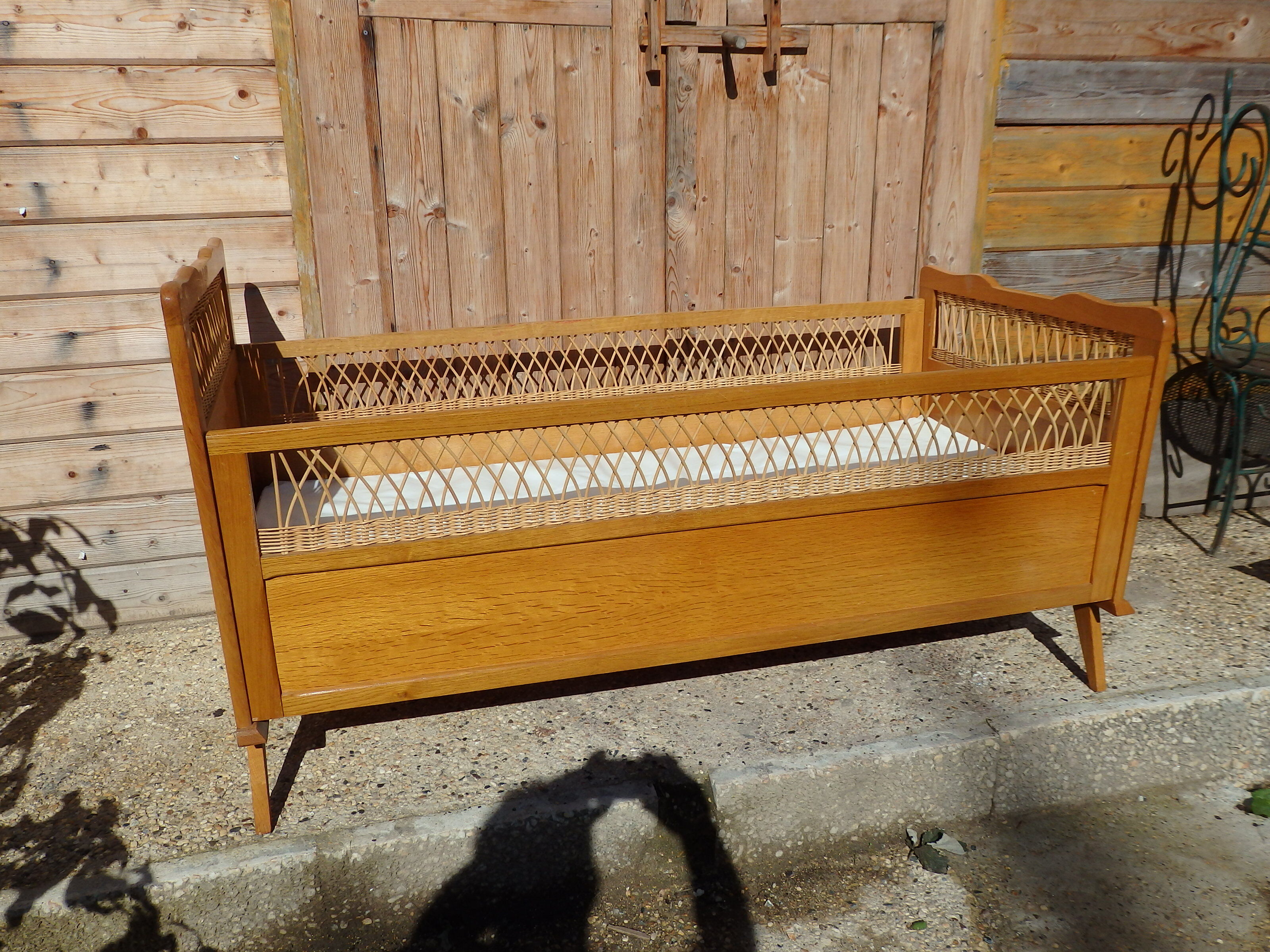 Vintage baby bed in rattan