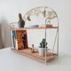 Vintage wall shelf or freestanding wicker in bohemian style.