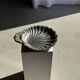 Large antique silver-plated bowl in the shape of a shell.