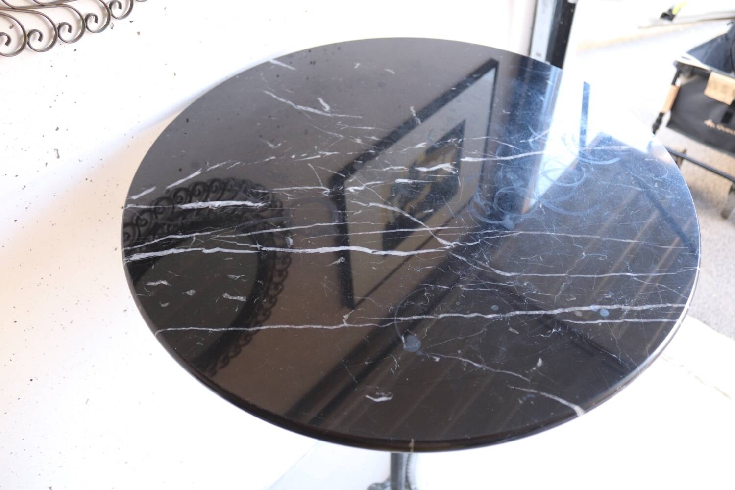 Antique bistro pedestal table in cast iron and veined black marble