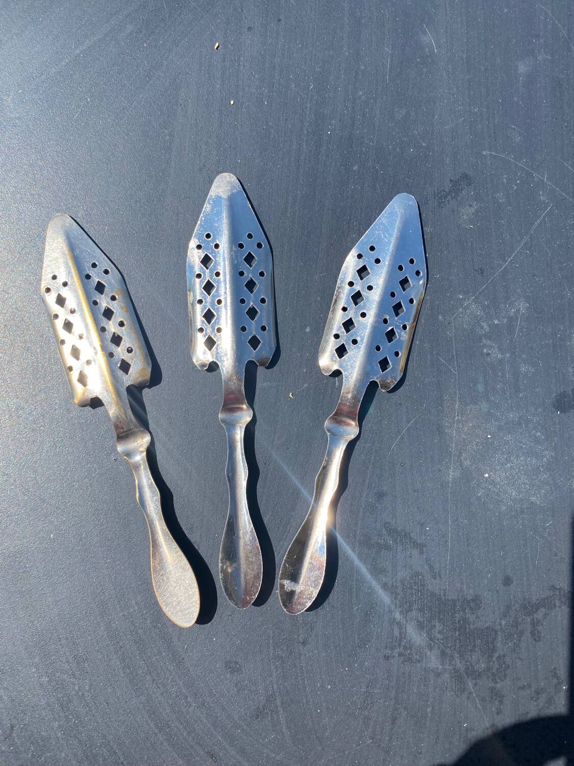 Lot 3 - Chiseled absinthe spoons