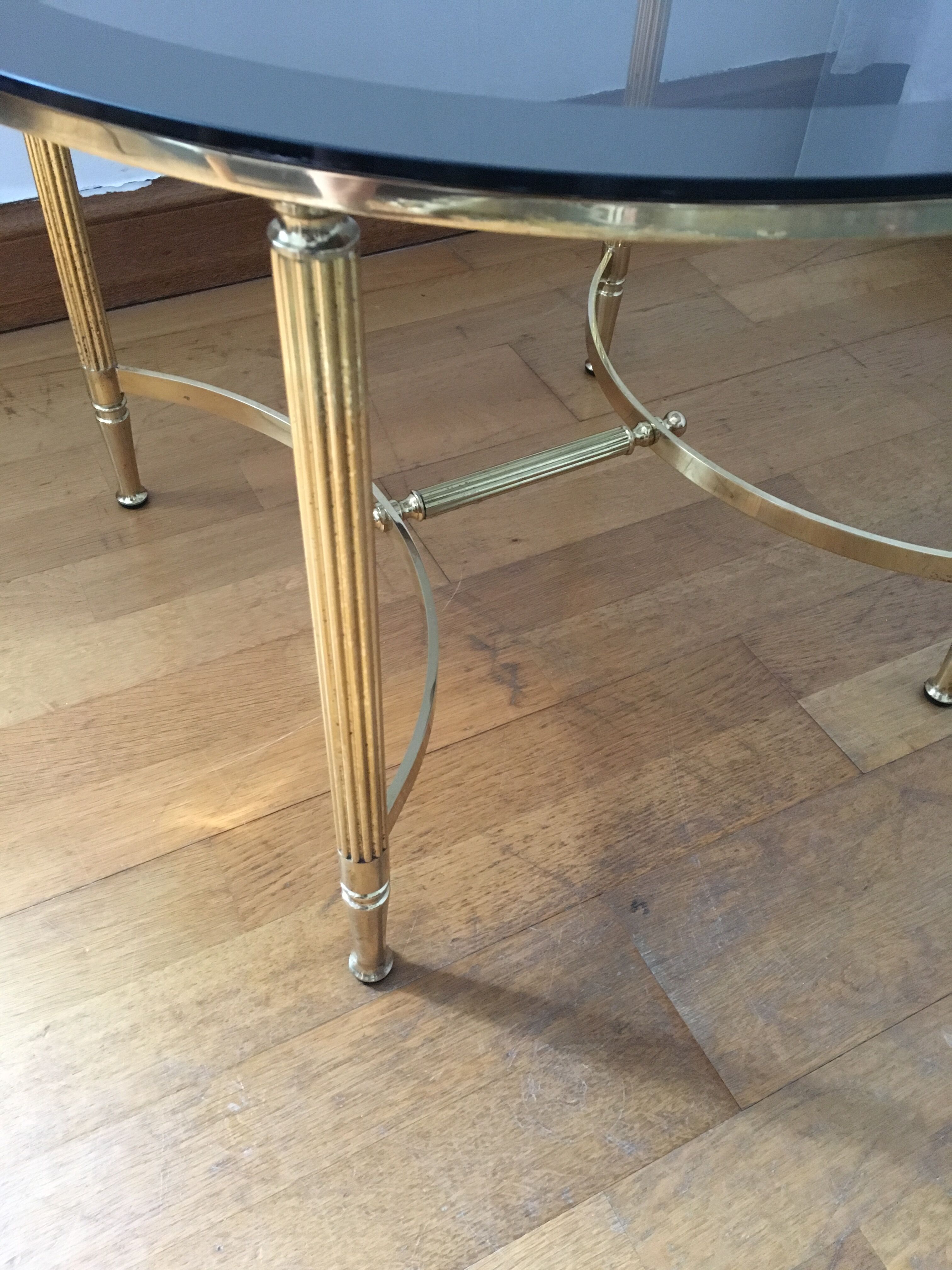 Brass round coffee table and smoked glass