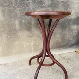Pedestal table in curved wood