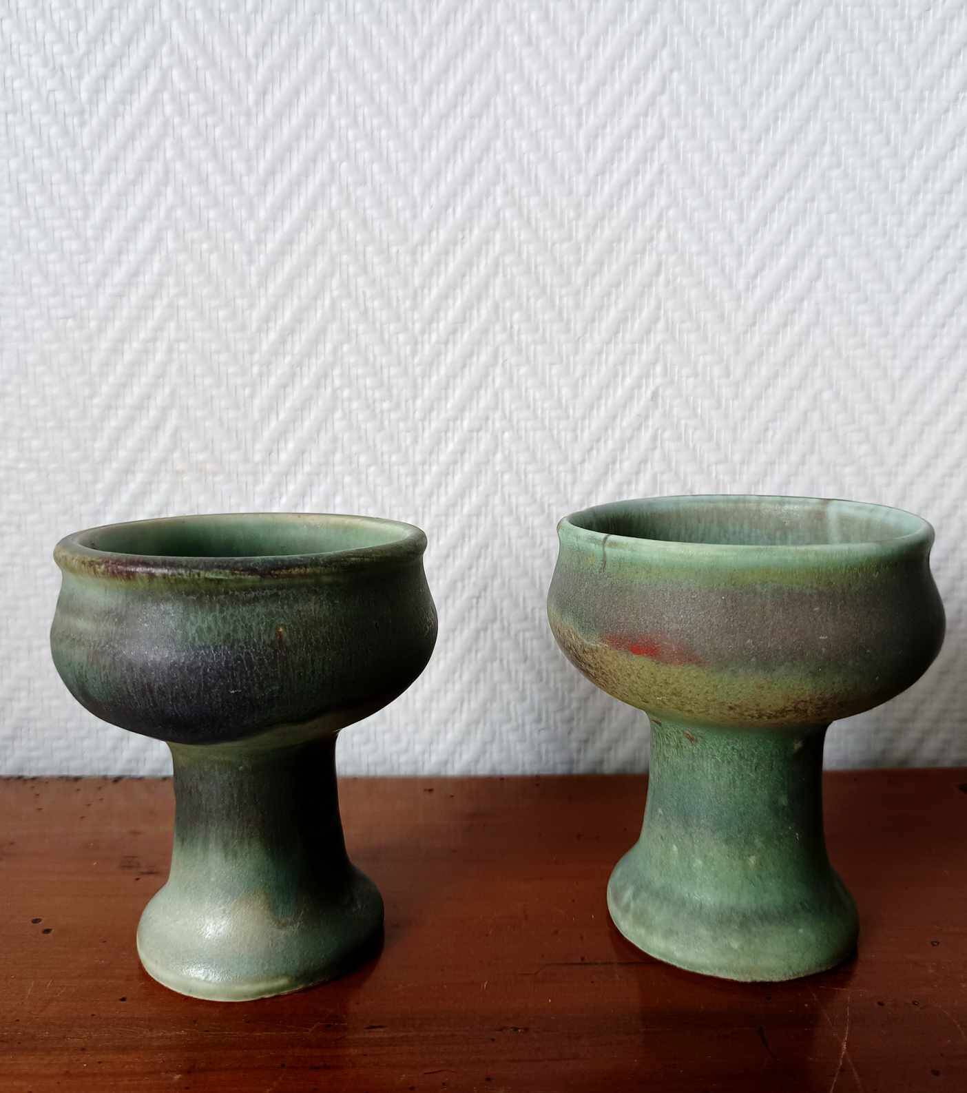 Pair of Belgian ceramic candlesticks on feet