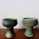 Pair of Belgian ceramic candlesticks on feet