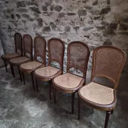 Set of 6 antique Louis XVI style dining chairs with caning.