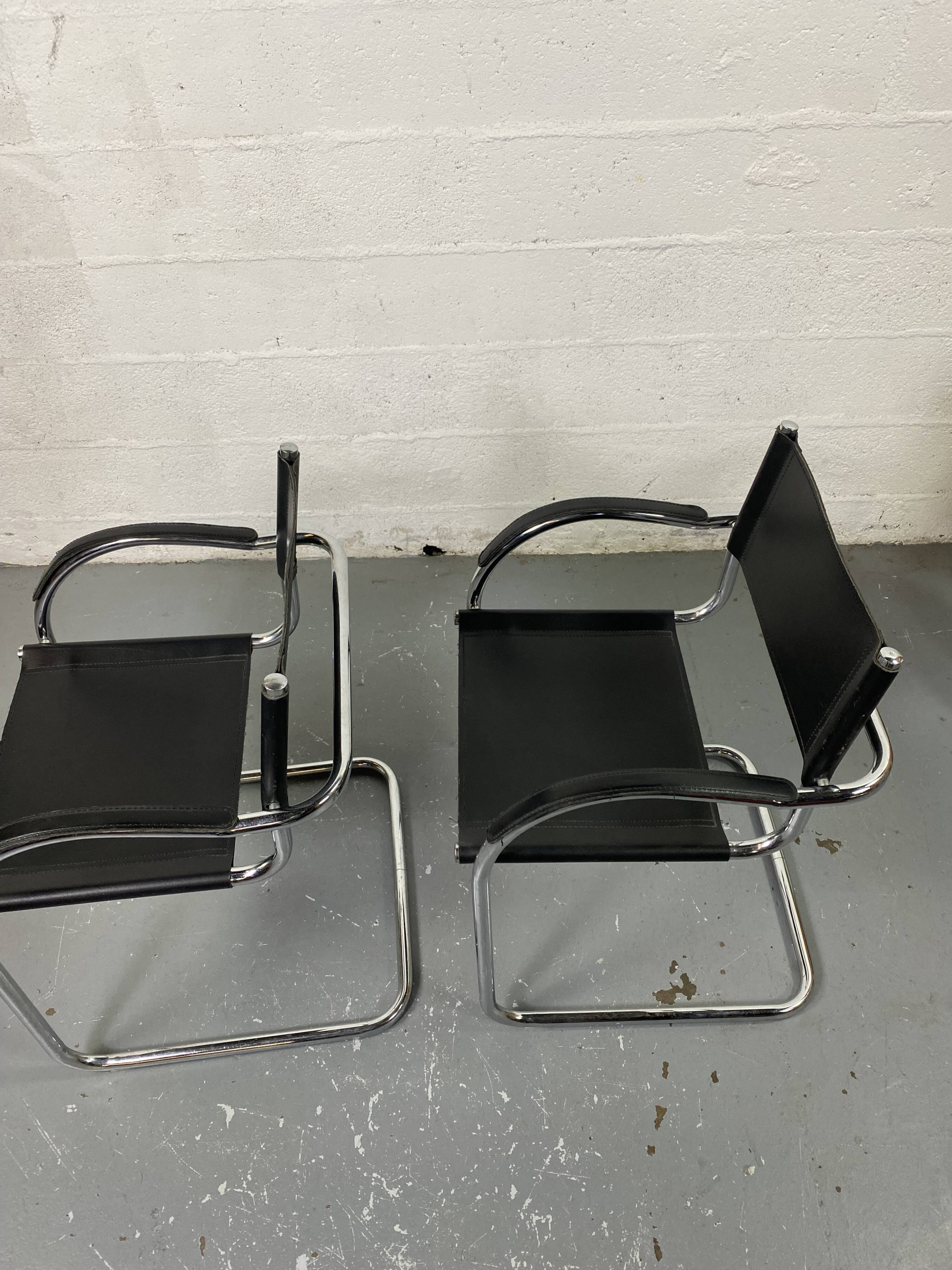 Pair of design armchairs in imitation leather chrome