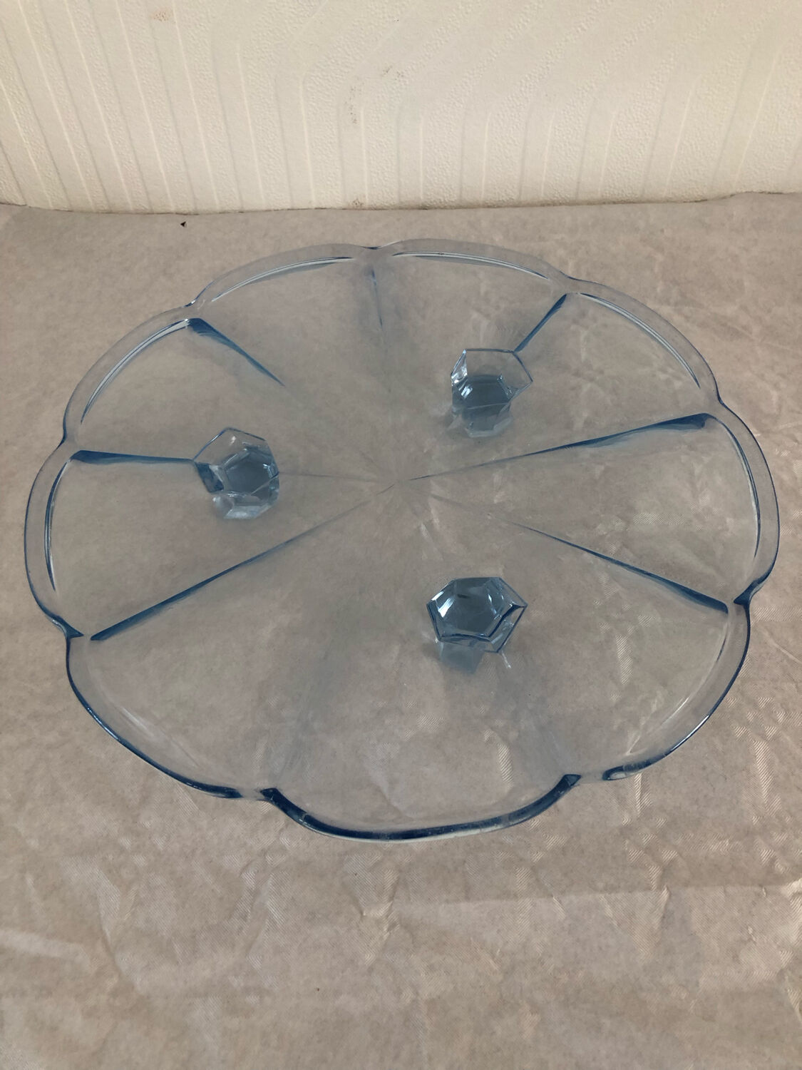 Blue transparent glass pie dish on vintage stand