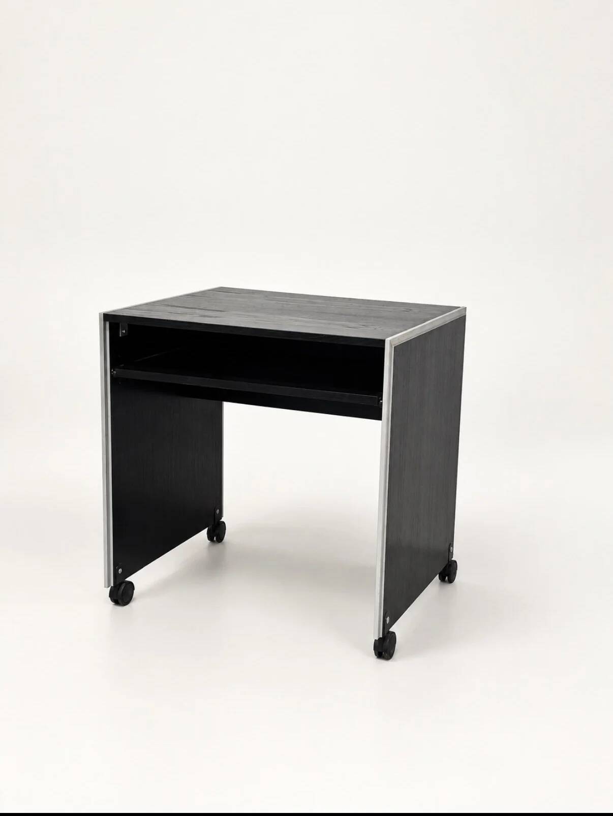 Vintage black computer desk on wheels with an aluminium edge.