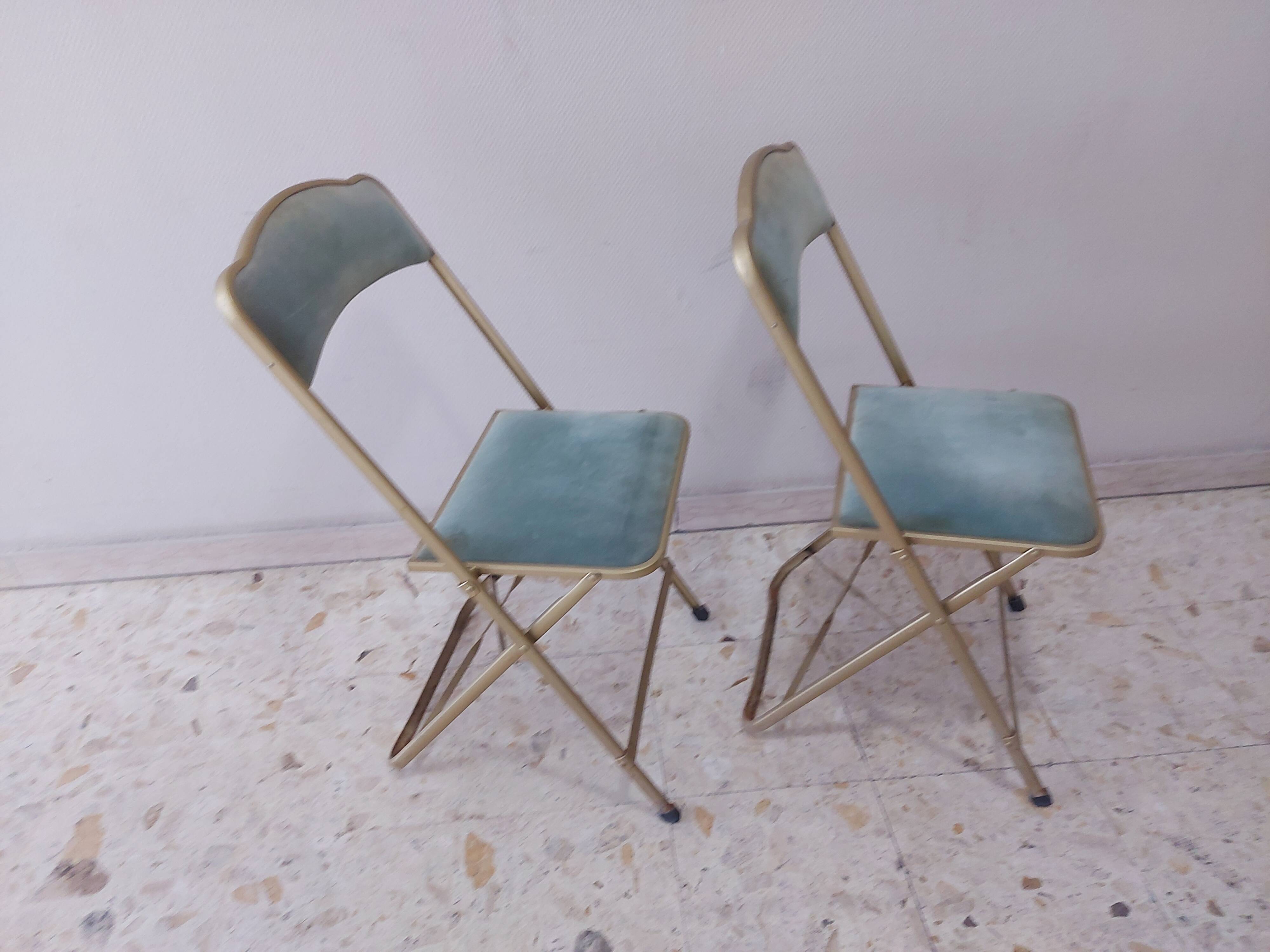 Two folding opera chairs in velvet