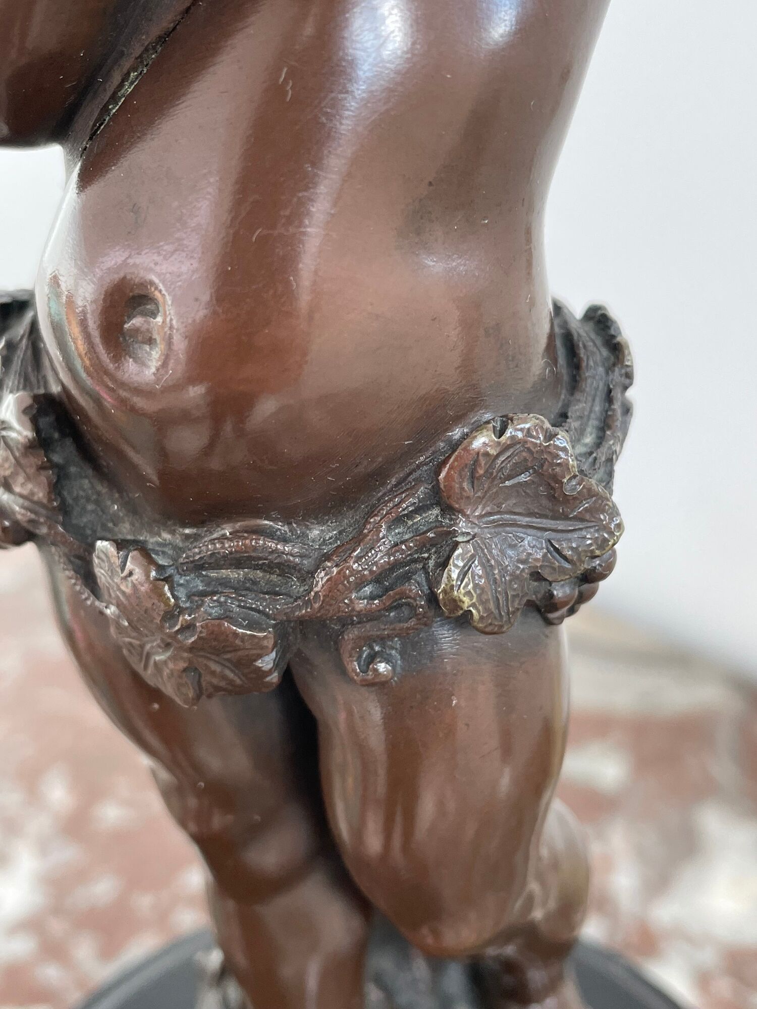 Candelabra with cherub in patinated bronze