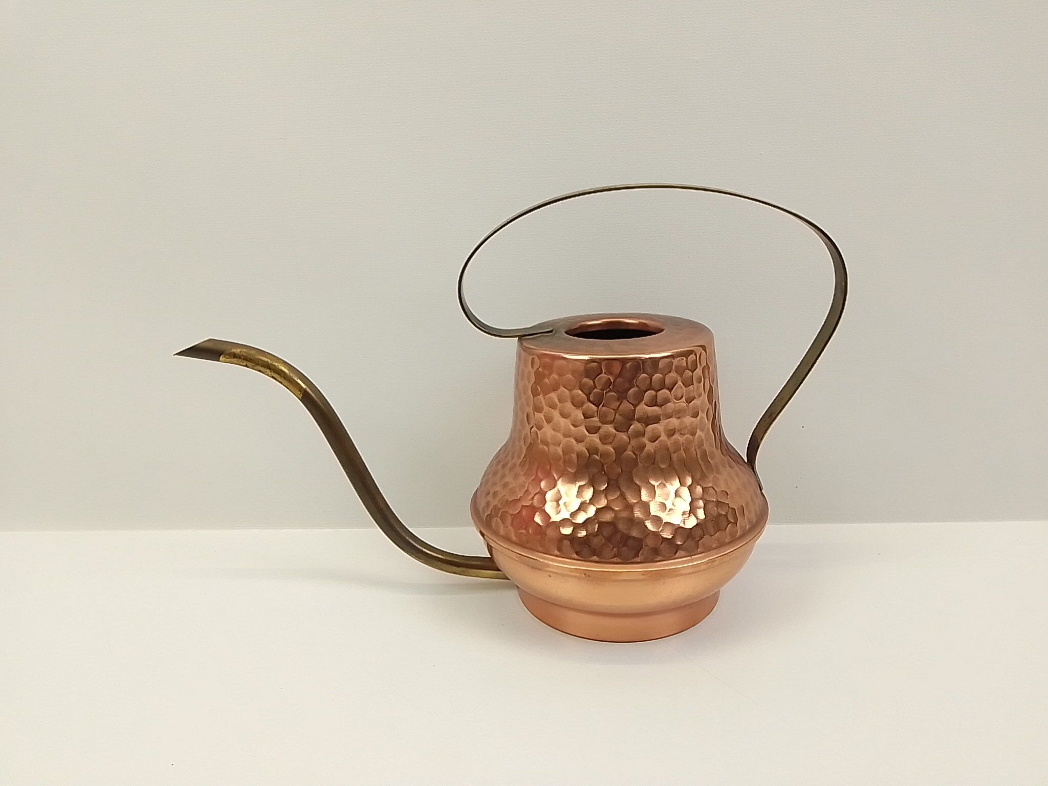 Copper and brass watering can
