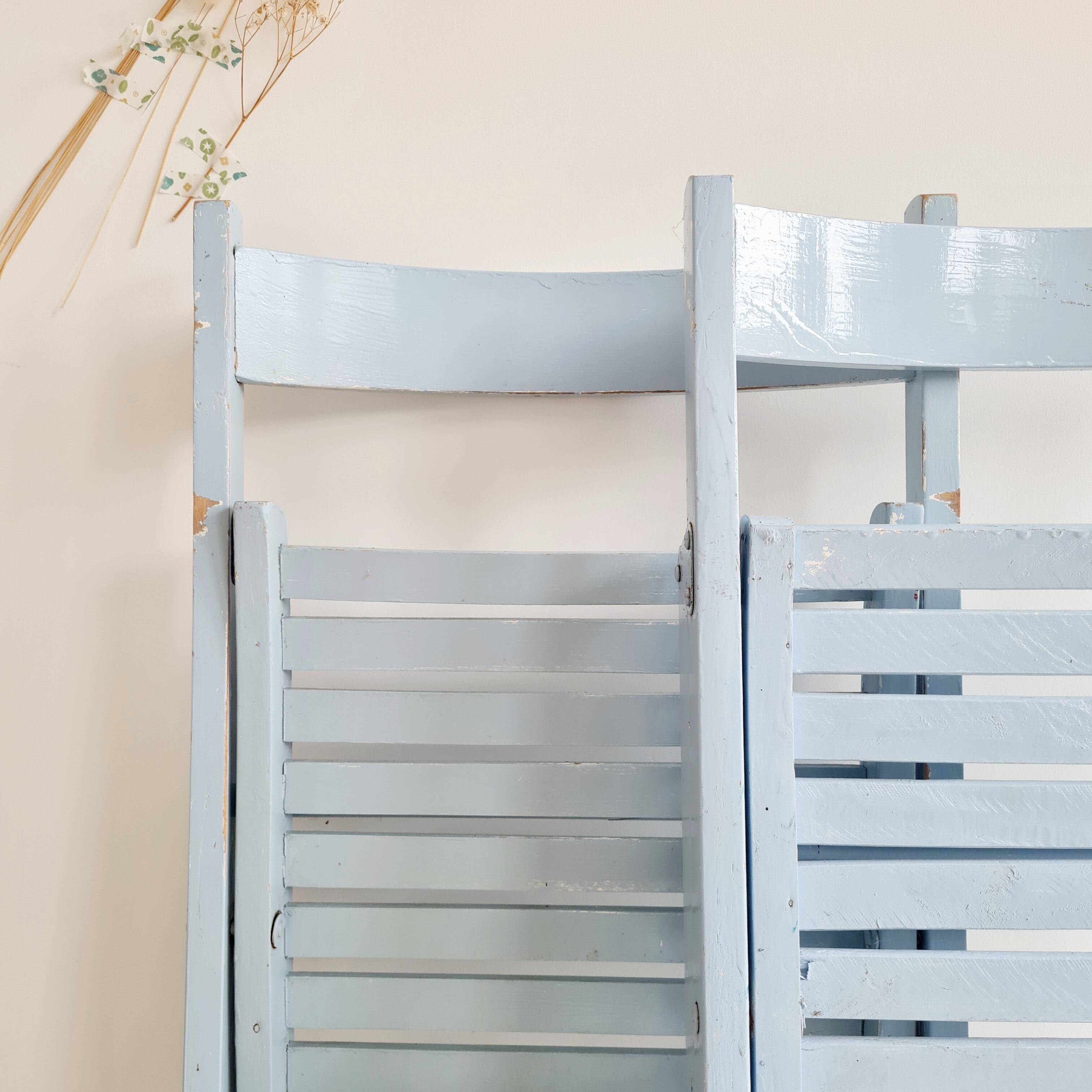 Blue folding chairs in lacquered wood