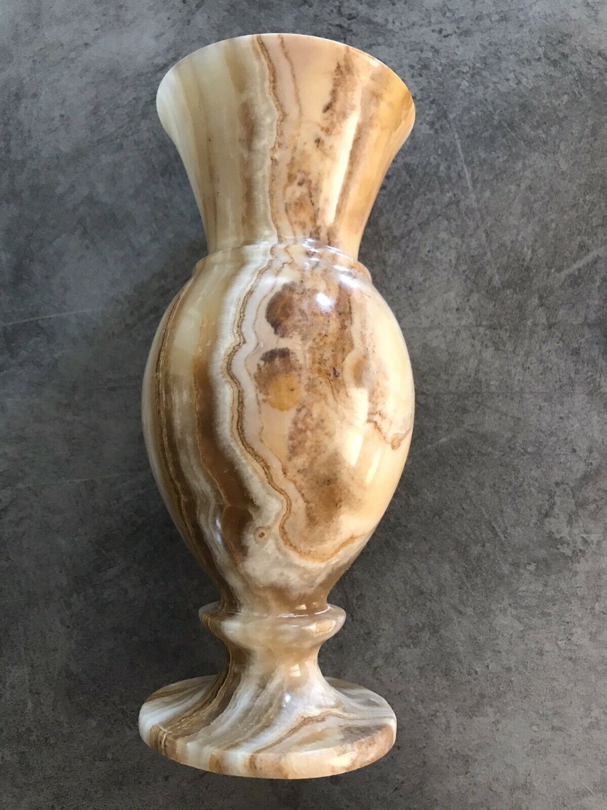 Vintage vase in marbled onyx stone shades of beige and brown