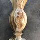Vintage vase in marbled onyx stone shades of beige and brown
