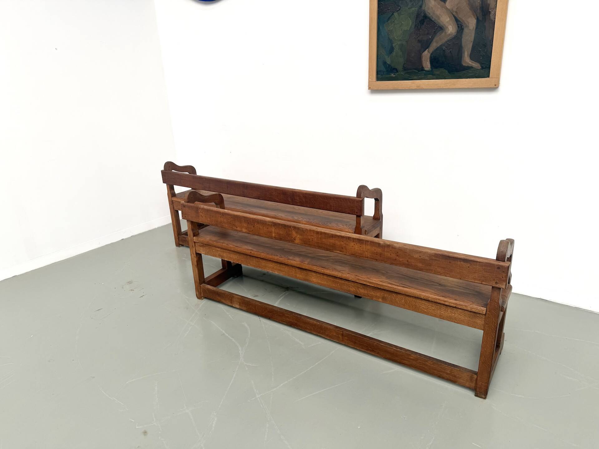 Pair of communal benches in solid oak, 1950s.