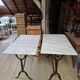 Pair of bistro tables in marble and cast iron.