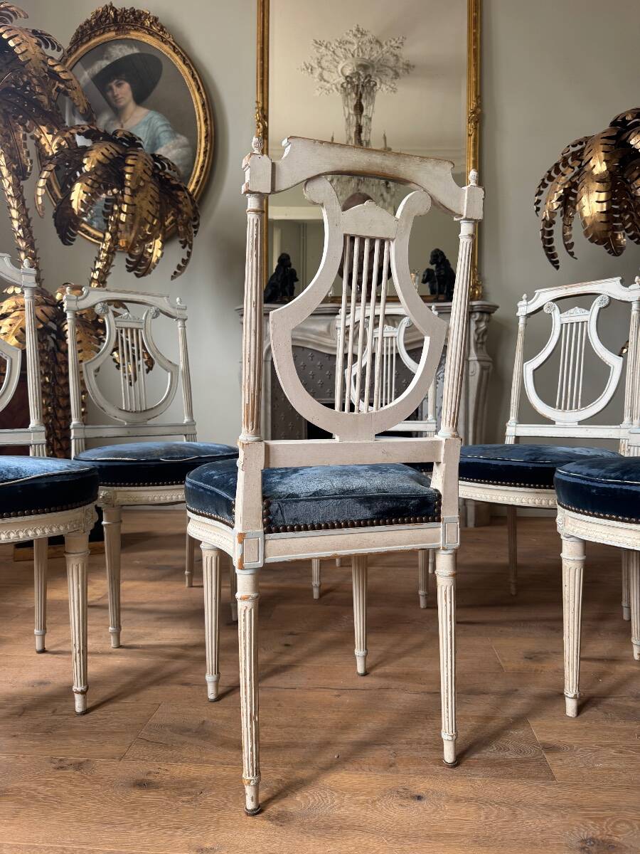Set of 6 lyre chairs from the Napoleonic III period in painted wood in the Louis XVI style.