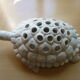 Pique flowers turtle in glazed white ceramic