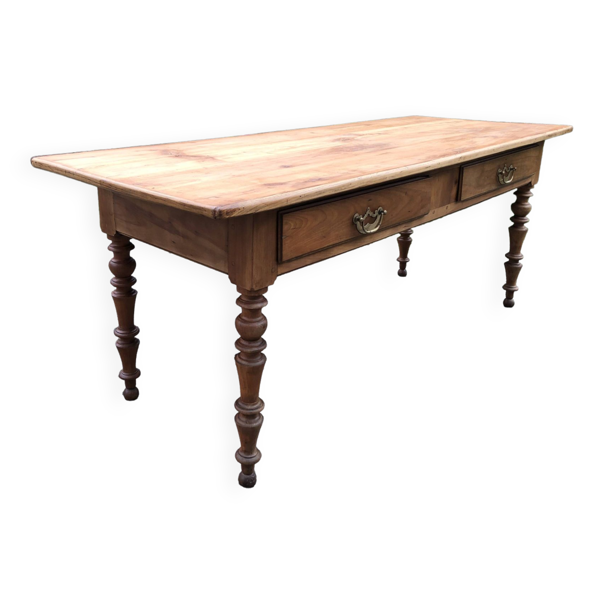 Antique Louis Philippe style farm table in solid cherry wood with 2 drawers and turned base.