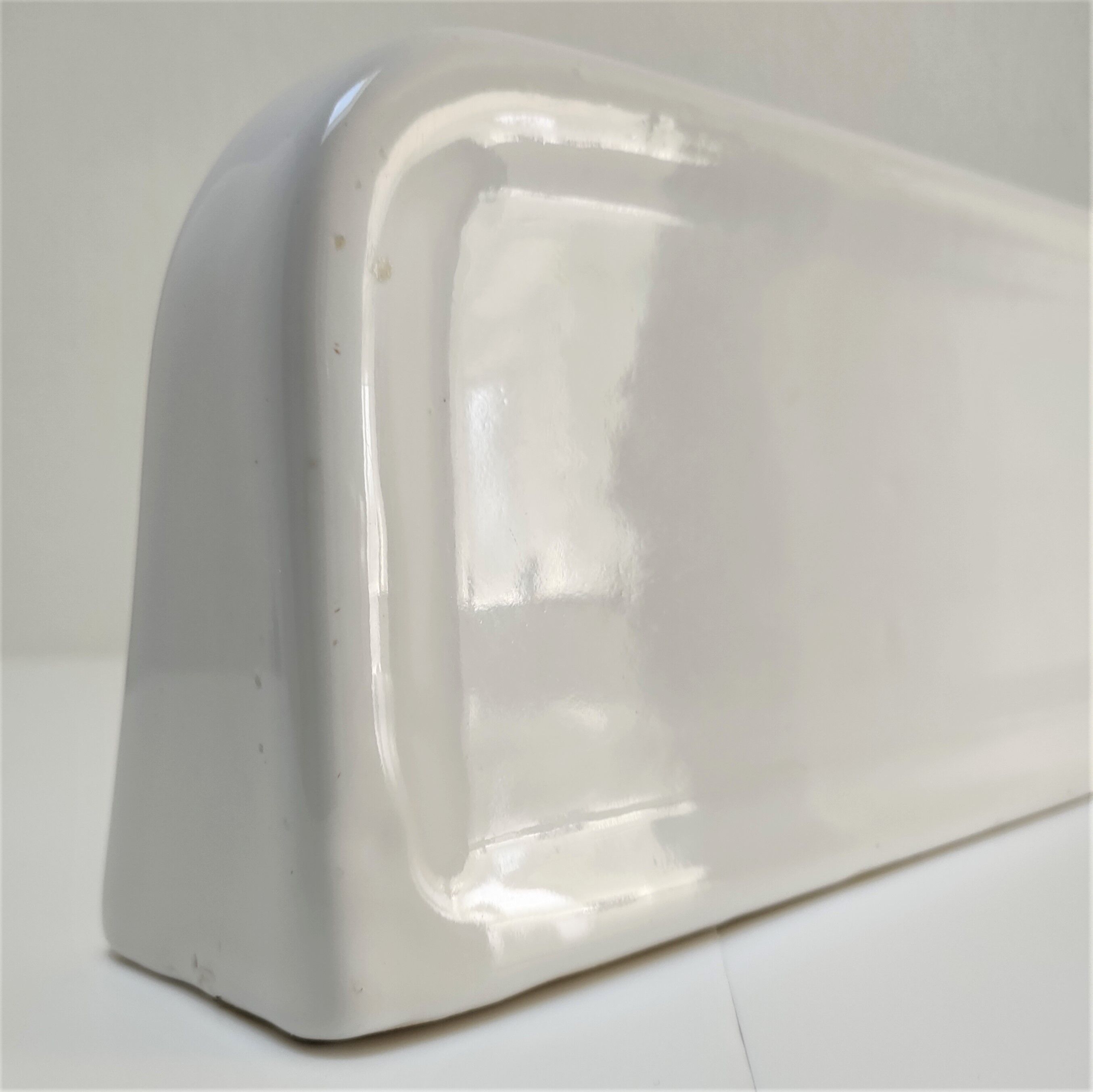 Vintage white glazed ceramic wall shelf