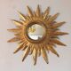 Sun mirror in carved gilded wood from the 1950s